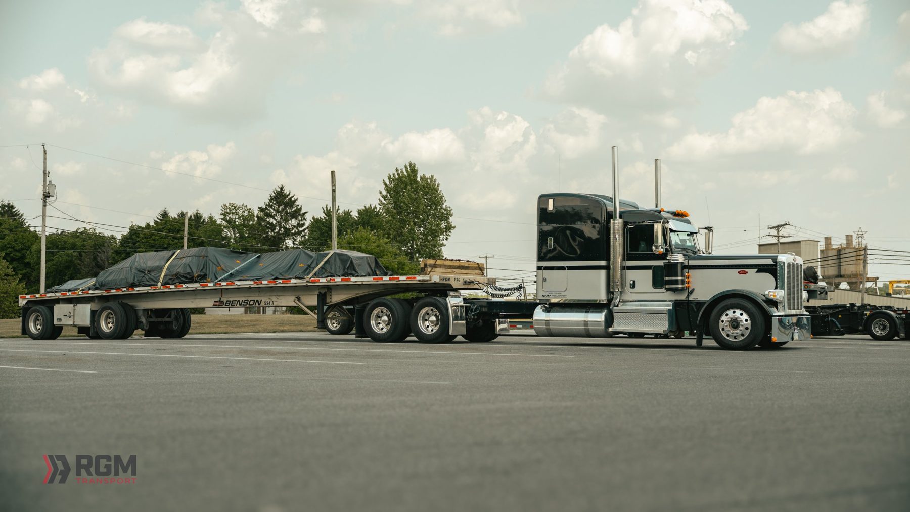 RGM Peterbilt with a tarped flatbed load