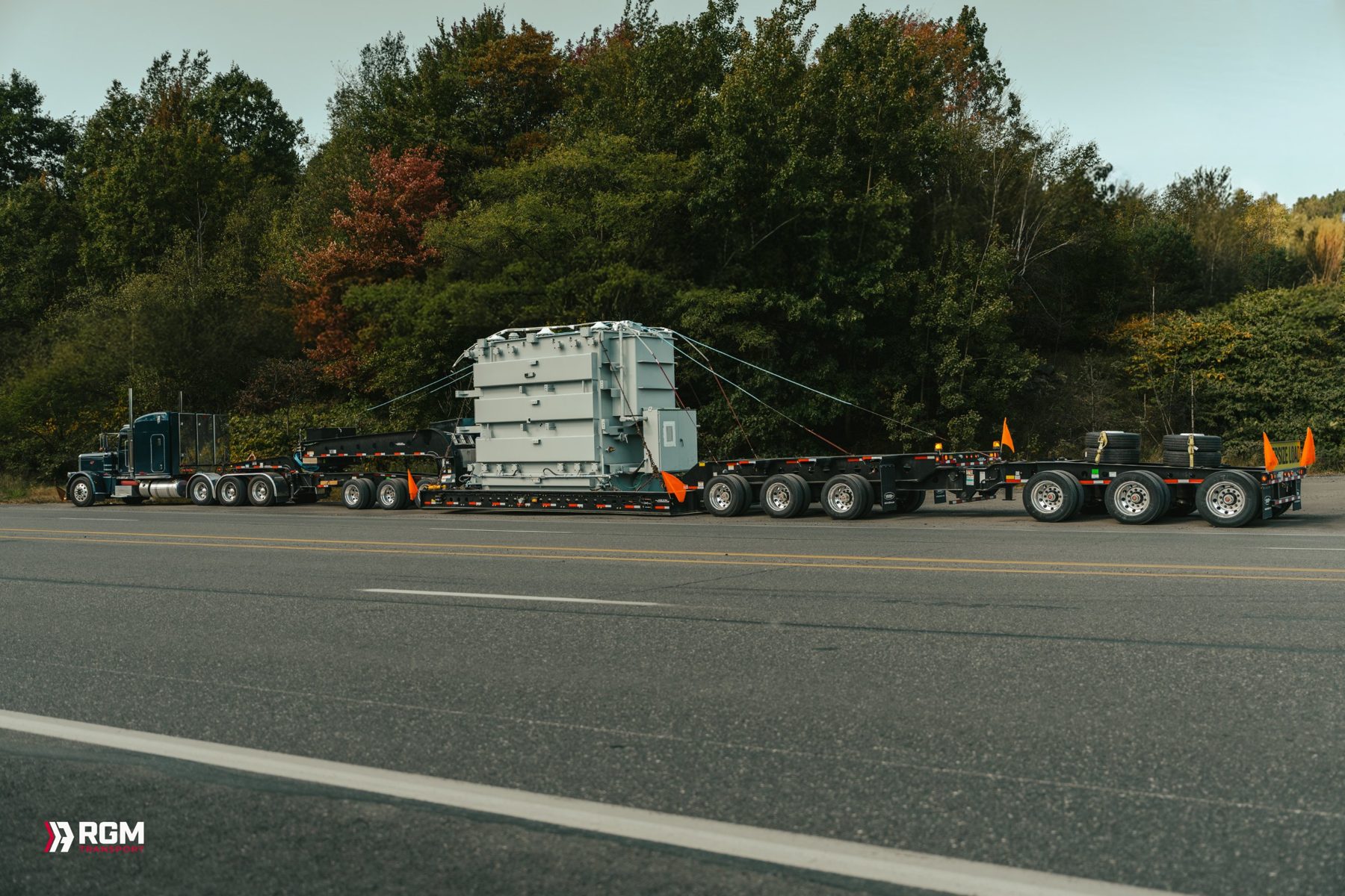RGM Peterbilt hauling a transformer on a multi-axle trailer